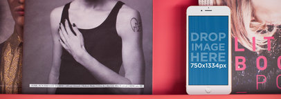 Mockup of an iPhone 6 Lying on Top of a Fashion Magazine