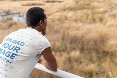 Back View Mockup of a Man Wearing a T-Shirt Looking to the Horizon Outdoors 24529