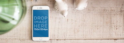 iPhone 6 Lying on Top of a White Wooden Cabinet Mockup