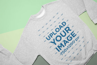 Mockup of a Crewneck Sweatshirt Lying with Its Sleeves Partly Folded 24558