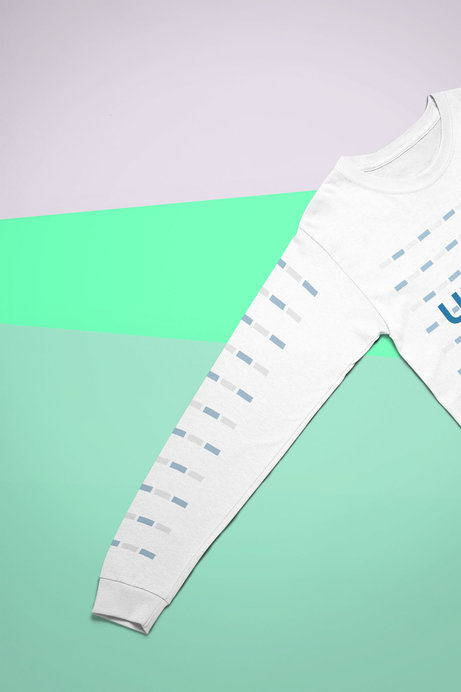 Mockup of a Long Sleeve T-Shirt Laid on a Tricolor Surface