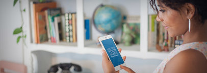 iPhone Mockup Featuring a Woman Using an iPhone 7 at the Office