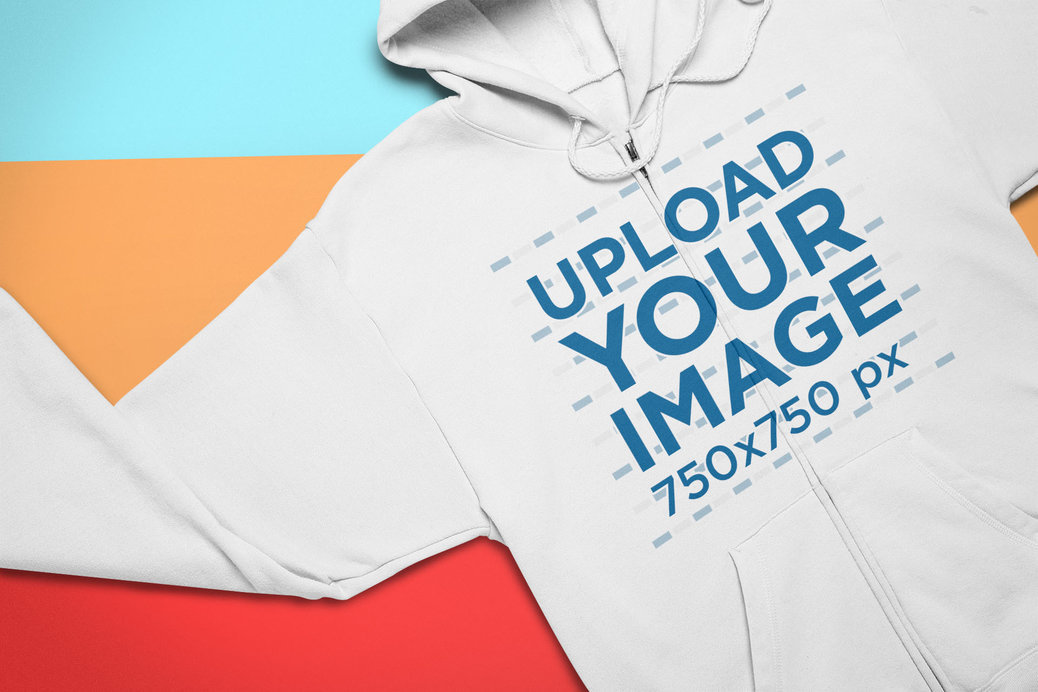 Mockup of a Full Zip Hoodie Lying Over Colored Pasteboards