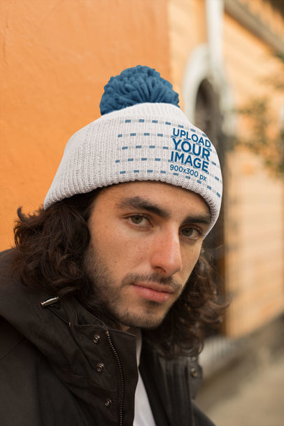 Mockup of a Handsome Man Wearing a Pom Pom Beanie 