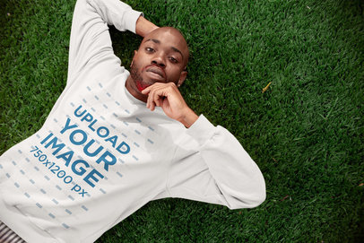 Sweatshirt Mockup of a Man Lying on Grass 21689