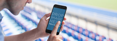 Mockup Featuring a Man Using an iPhone 7 at a Soccer Stadium