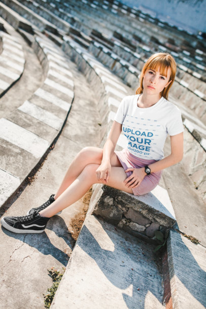 Tshirt Mockup Featuring a Girl with a Street Style Outfit Sitting on Stone Steps  20128