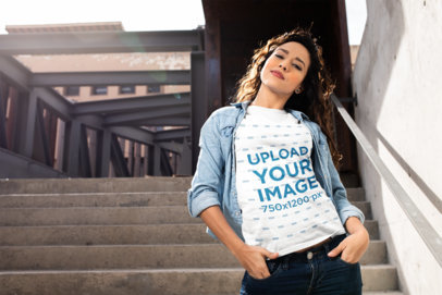 Mockup of a Woman with Curly Hair Wearing a Tee