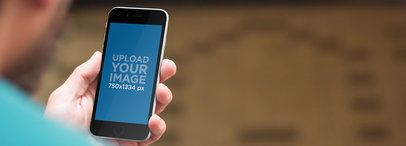 iPhone Mockup of a Guy Holding a Black iPhone