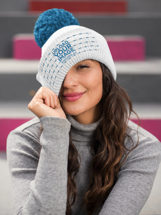 Mockup of a Beautiful Brunette Woman Wearing a Pom Pom Beanie