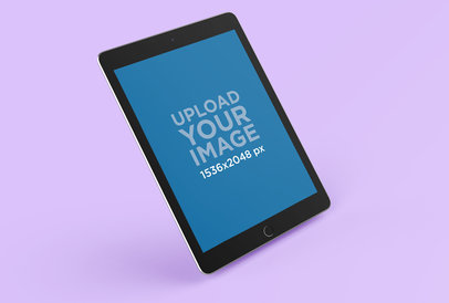 Mockup of an iPad Air 2 Leaning Slightly Over a Flat Surface 25050