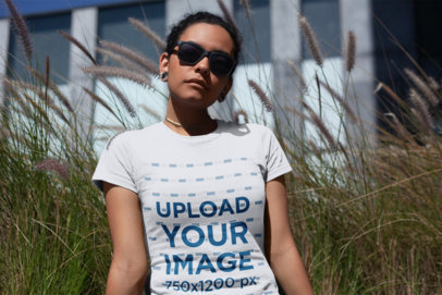 T-Shirt Mockup of a Woman with Sunglasses Looking Seriously at the Camera 18247
