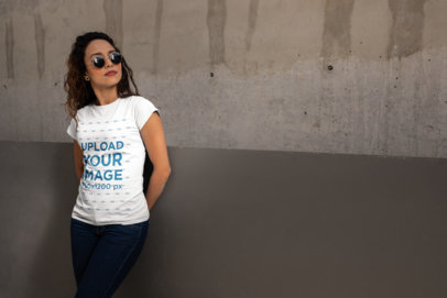 T-Shirt Mockup of a Woman Wearing Sunglasses and a Casual Outfit