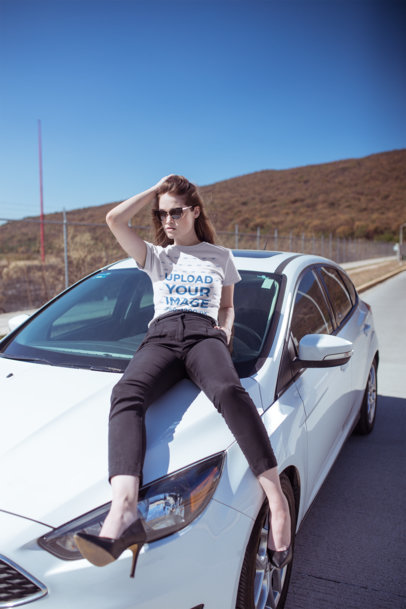 Mockup of a Stylish Woman Wearing a Tee and Heels Posing on a Car