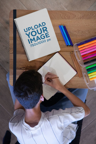 School's Notebook Mockup of a Boy Sketching
