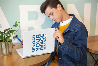 Mockup of a Boy Reading from His School Notebook
