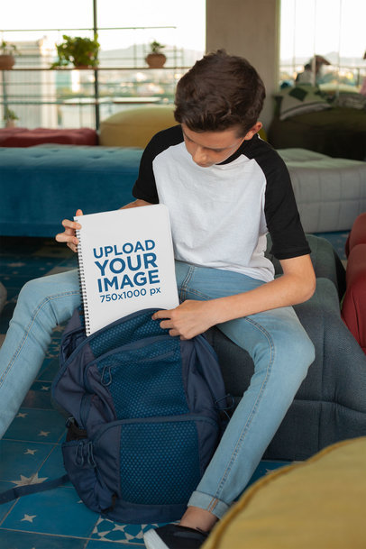 Mockup of a Boy Putting Away His School's Notebook