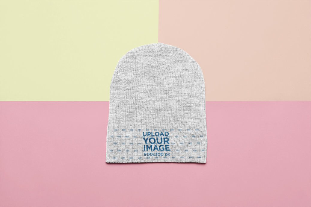 Flat Lay Mockup of a Beanie over a Multicolor Background