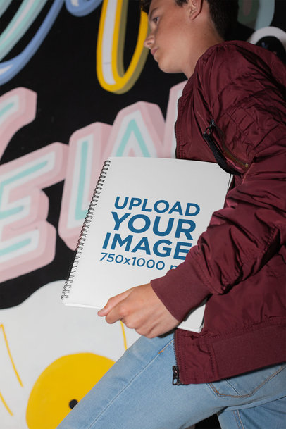 Mockup of a Young Boy Carrying a Spiral Notebook
