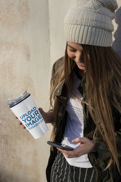 Travel Mug Mockup Featuring a Girl Looking at Her Phone 24337
