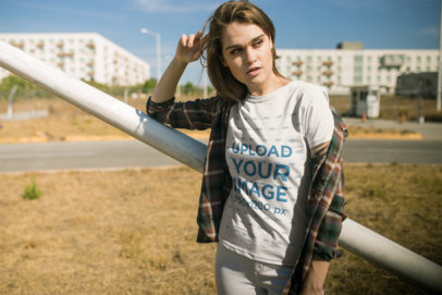 T-Shirt Mockup Featuring a Trendy Woman Wearing a Flannel Tee