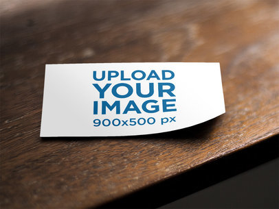Business Card Mockup Lying on Top of a Wooden Table