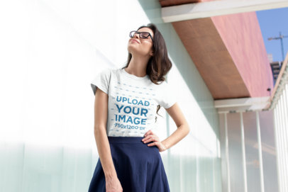 T-Shirt Mockup Featuring a Pretty Woman with a Skirt Posing 