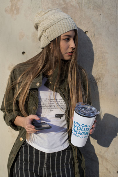 Mockup of a Beautiful Woman Holding a Travel Mug