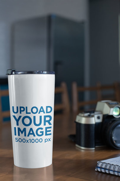 Mockup of a Travel Mug on a Wooden Table 24450