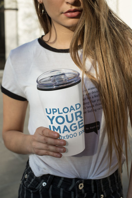 Mockup of a Woman Holding a Travel Mug
