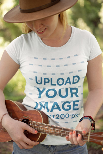 Mockup of a Woman Wearing a Tee Playing a Ukelele