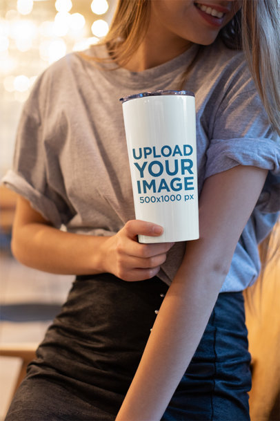 Mockup of a Smiling Woman Holding a Tumbler