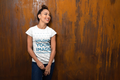 Mockup of a Happy Woman with a Bun Wearing a T-Shirt