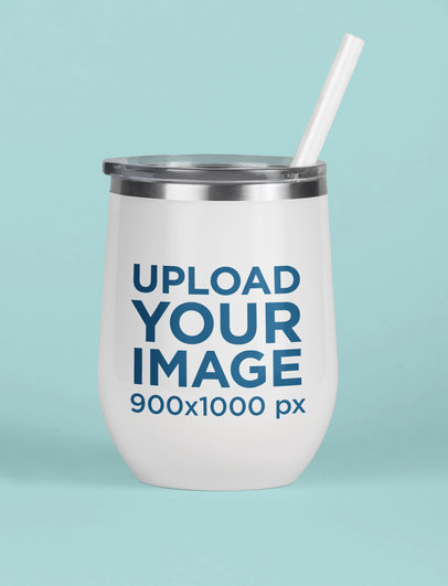 Mockup of a Tumbler with a Straw Standing on a Solid Surface