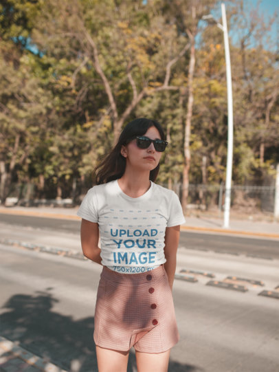 Mockup of a Woman Wearing a Round Neck Tee on the Street