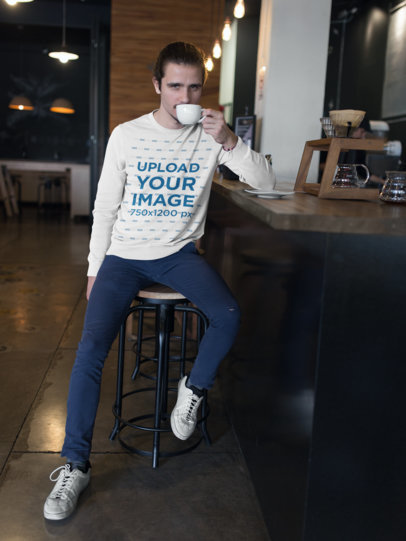 Crewneck Sweater Mockup of a Man Having a Coffee