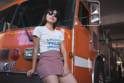 Mockup of a Cool Woman Wearing a T-Shirt in Front of a Fire Truck