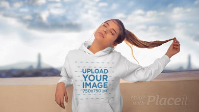 Parallax Video Featuring a Woman Wearing a Hoodie on a Rooftop