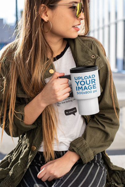 Mockup of a Woman Holding a Travel Mug Outside an Office