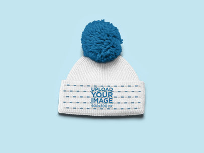 Mockup of a Pom Pom Beanie over a Flat Surface