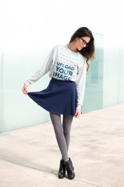 Sweatshirt Mockup of a Woman Posing Outside a Glass Building