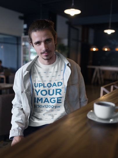 Sweatshirt Mockup of a Smiling Man at a Cafe