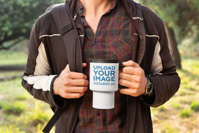 Mockup of a Man Hiking with His Travel Mug