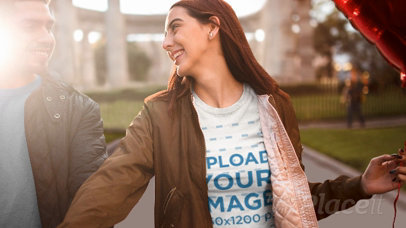 Valentine's Parallax Video Mockup of a Woman Wearing a T-Shirt While Holding a Heart Balloon