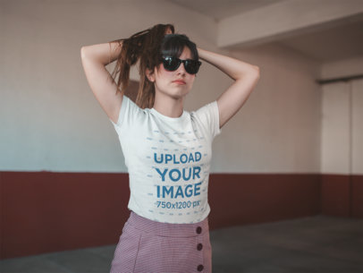 T-Shirt Mockup of a Girl Holding her Hair Indoors 19624