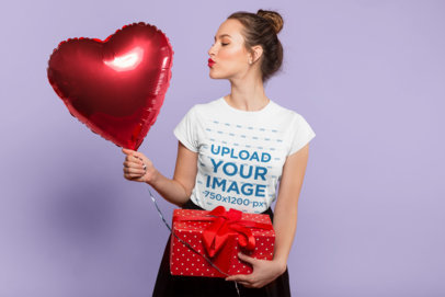 Valentine's Day Mockup of a Pretty Lady Wearing a T-Shirt Holding a Heart Balloon