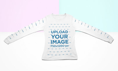 Mockup of a Long Sleeve Tee Lying Flat Over a Colorful Surface