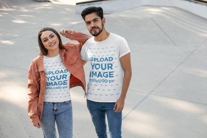 T-Shirt Mockup Featuring a Couple at a Skate Park 25230