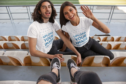 T-Shirt Mockup of a Happy Couple at a Stadium
