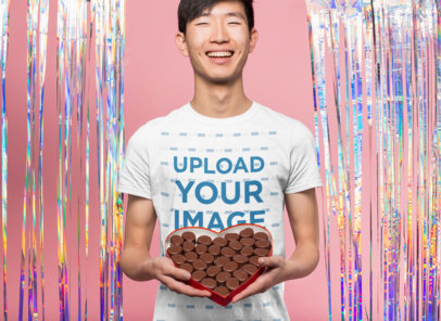 Valentine's Day T-Shirt Mockup of a Happy Man Holding a Box of Chocolates